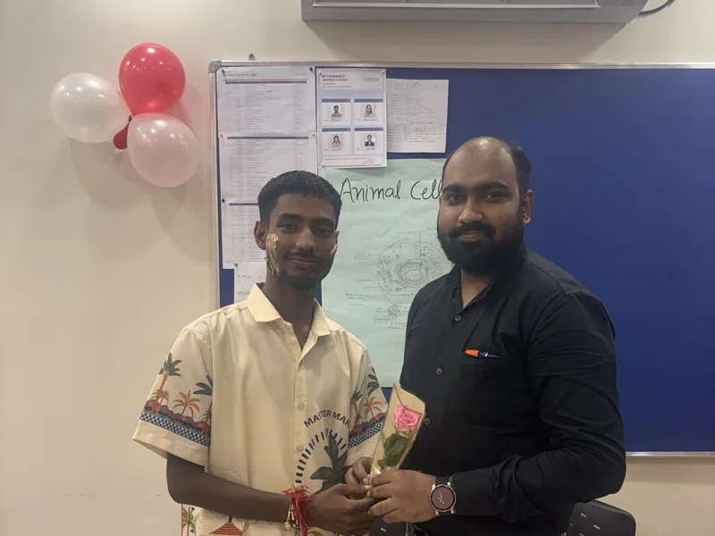 Student and faculty member celebrating Teacher's Day at Navvidya